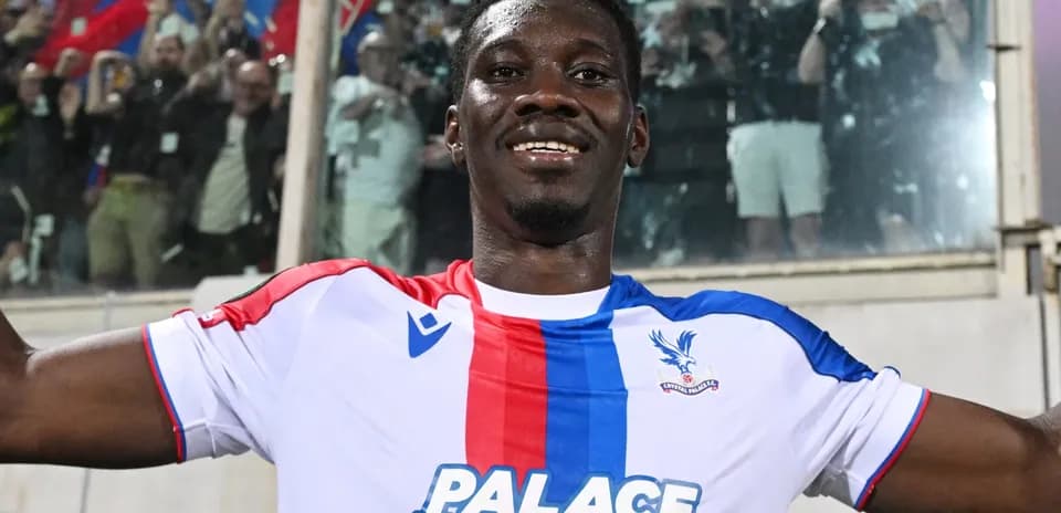 Player celebrating with fans after scoring goal