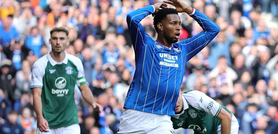 Player in blue celebrating a goal during match