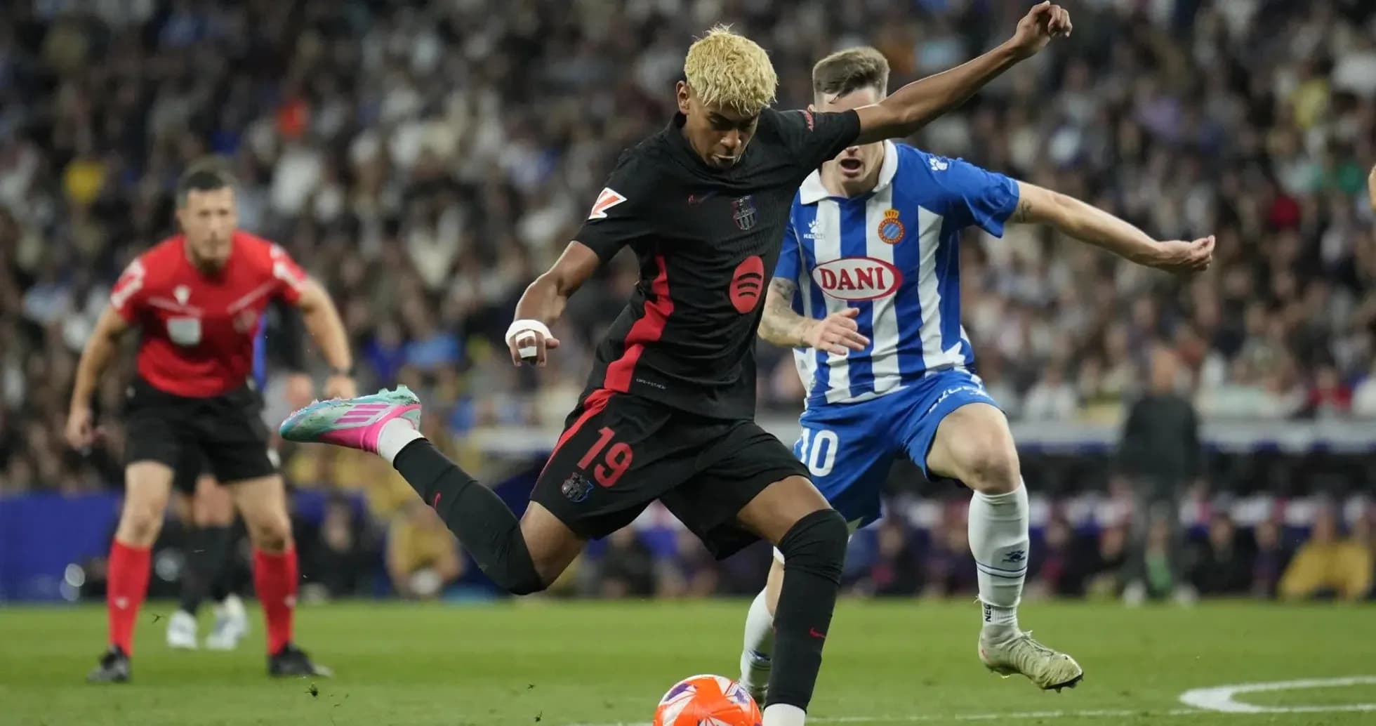 Barcelona player kicking ball against Espanyol