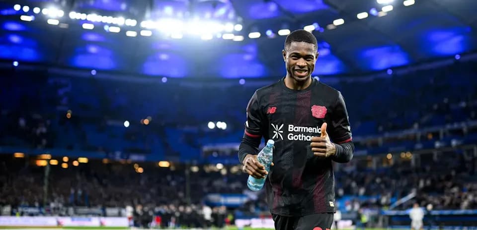 Player celebrating with water bottle on pitch