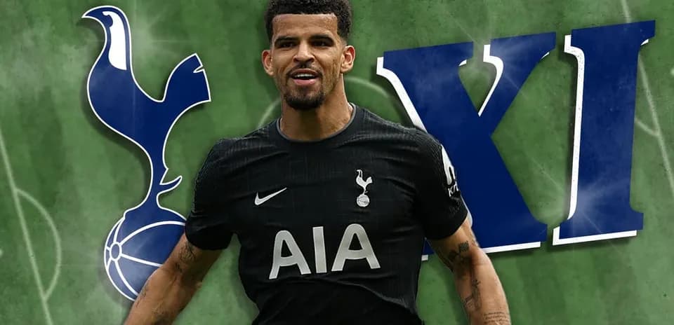 Player celebrating in Tottenham kit with club logo