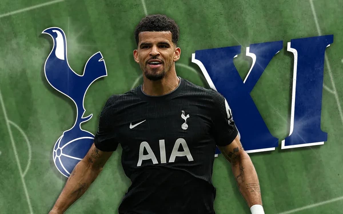 Player celebrating in Tottenham kit with club logo