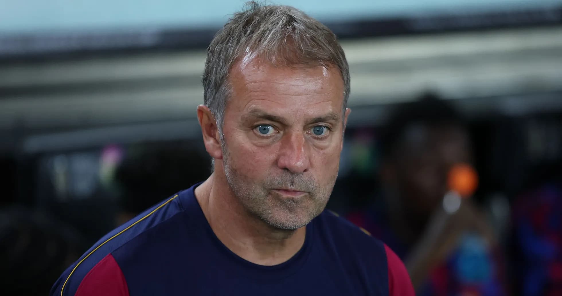 Coach observing from the sidelines during match