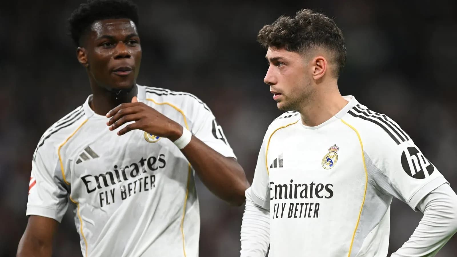 Two Real Madrid players discussing during a match