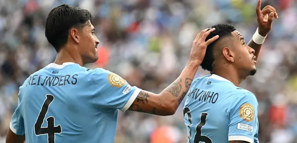 Two players celebrating a goal during match