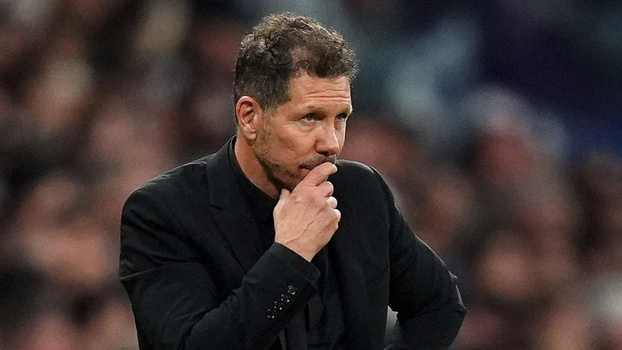 Manager observing the match with pensive expression