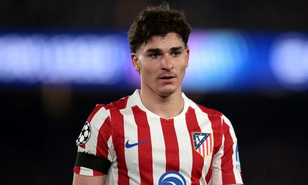 Atletico Madrid player in red and white striped jersey