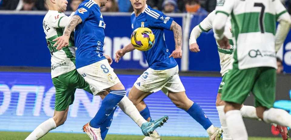 Oviedo players in action against Elche