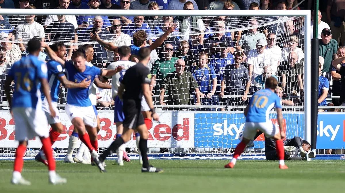 Players reacting after a goal attempt in football match