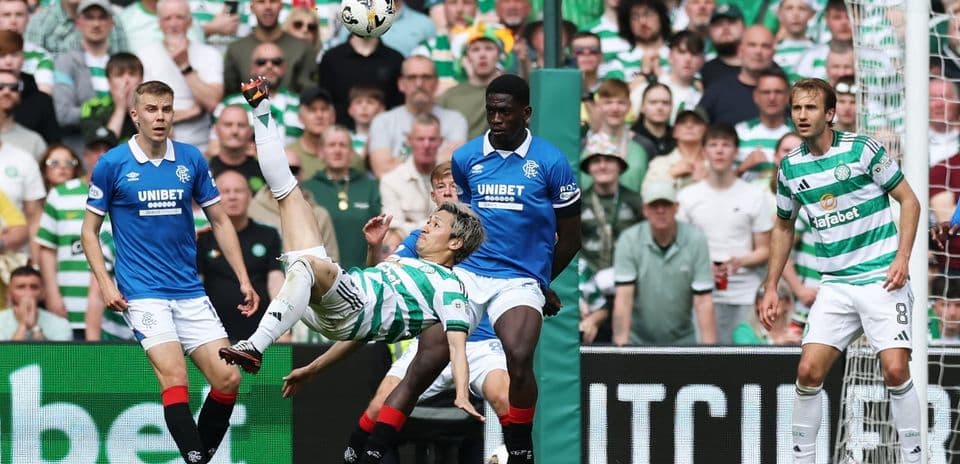 Celtic player performing a bicycle kick in match