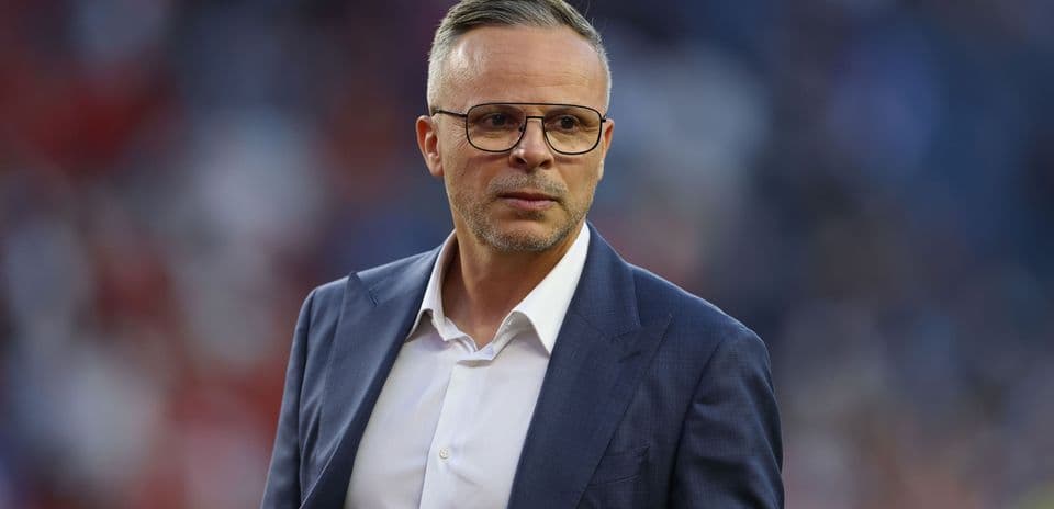 Coach walking on the sidelines during a match