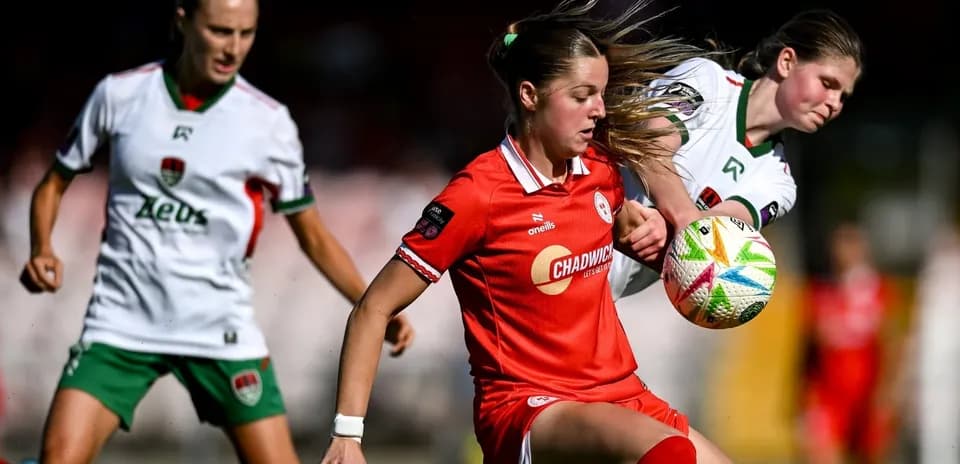 Two players contesting the ball during a match