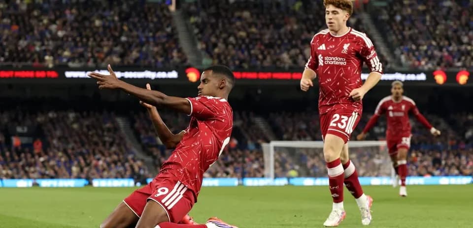 Liverpool players celebrating a goal on the field