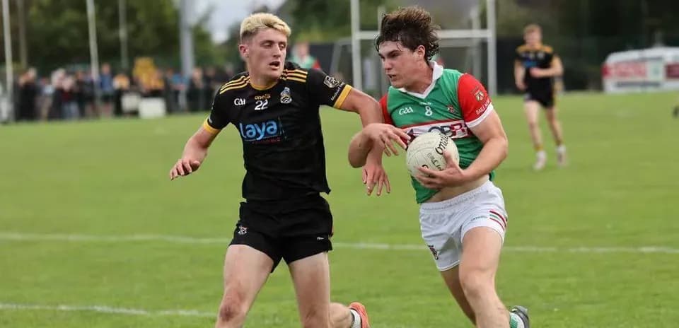 Two players competing for possession of a ball