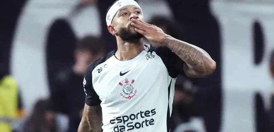 Player celebrating with a kiss gesture after scoring