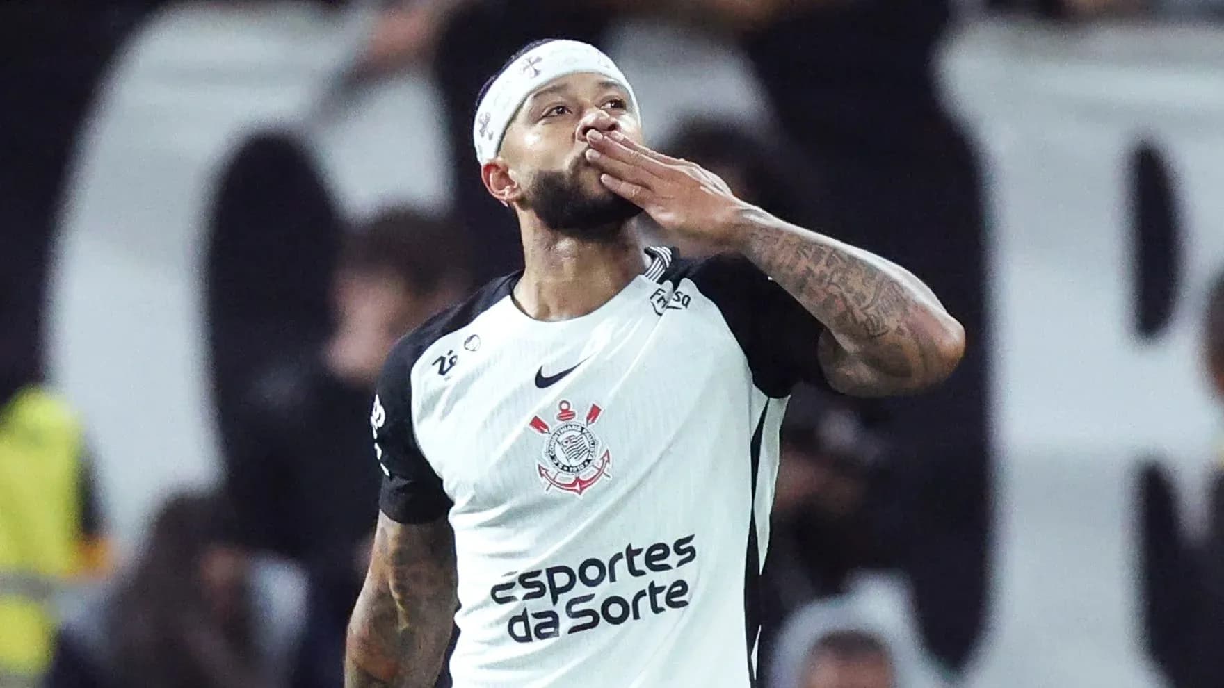 Player celebrating with a kiss gesture after scoring