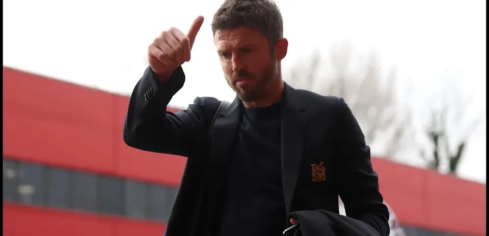 Man giving a thumbs up while entering stadium