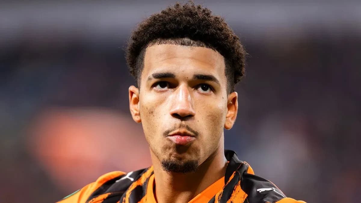 Player wearing orange jersey looking into distance