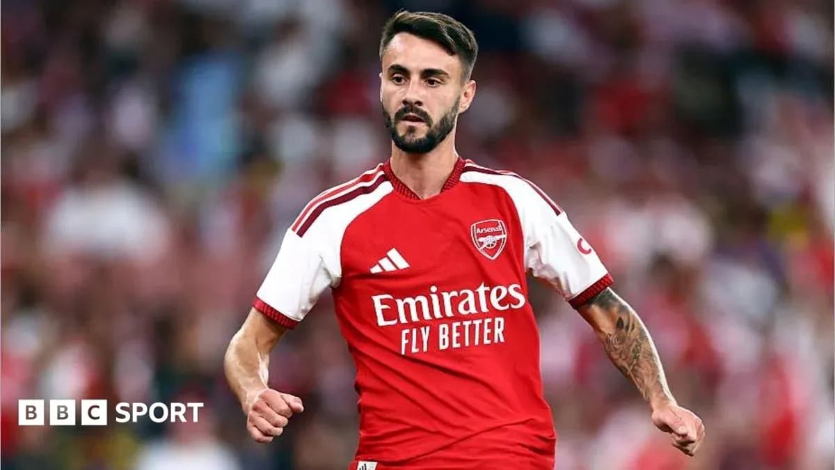 Player in Arsenal kit during match action