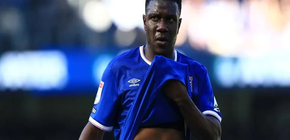 Player removing shirt during match on field