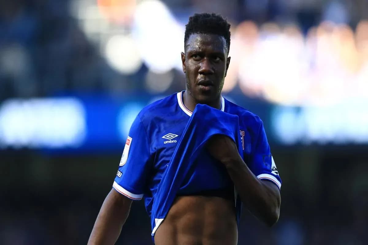 Player removing shirt during match on field