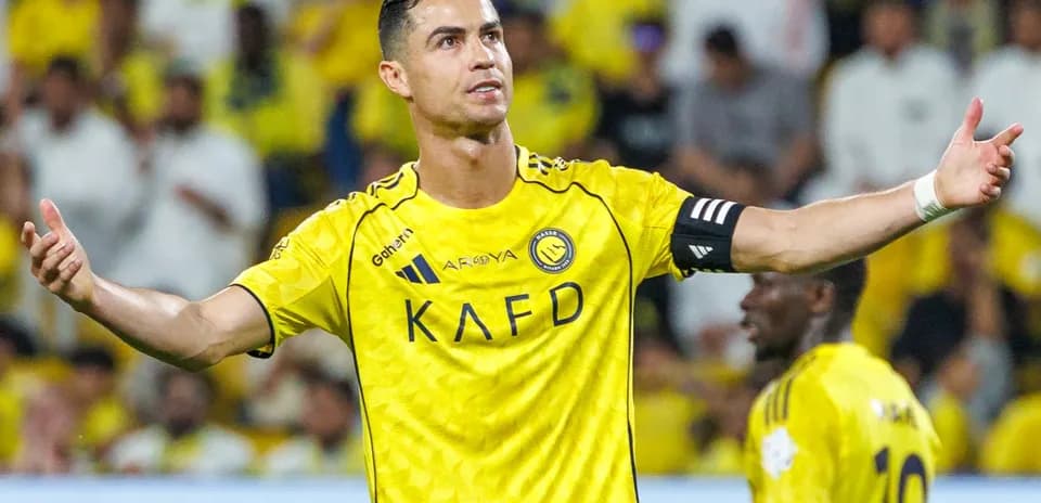 Player gesturing during match in yellow team uniform