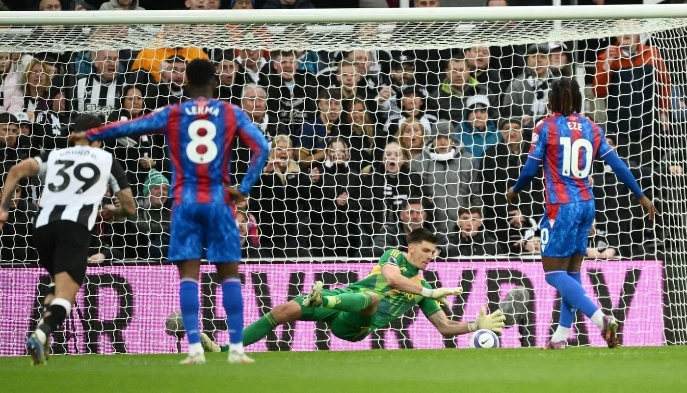 Goalkeeper saving a penalty in football match