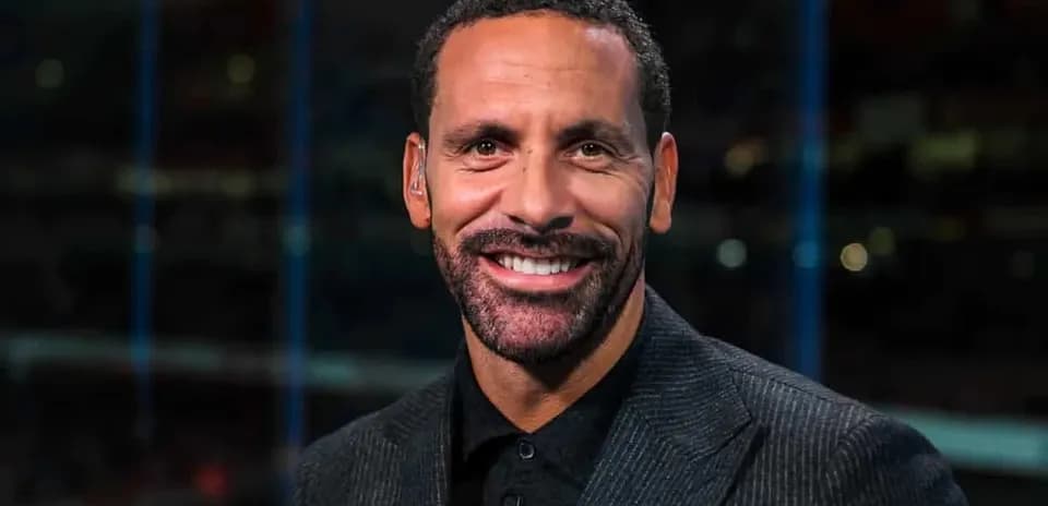 Sports analyst smiling in studio setting