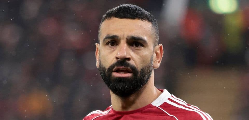 Football player in red jersey during match