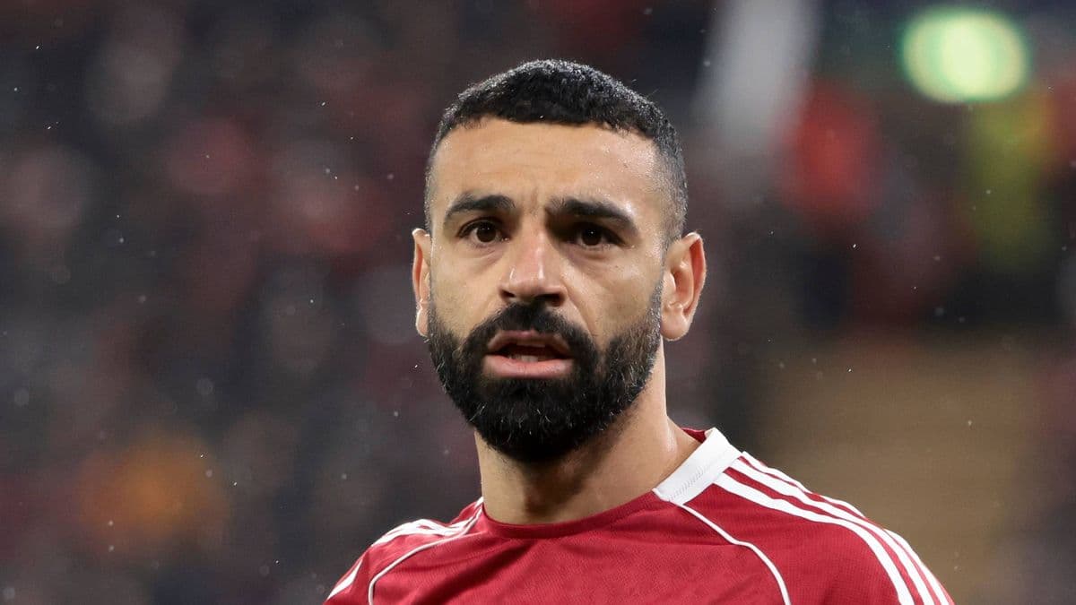 Football player in red jersey during match