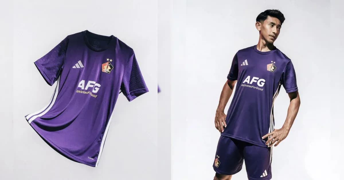 Purple football kit displayed and worn by a player