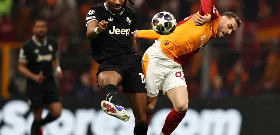 Two players challenging for the ball during match