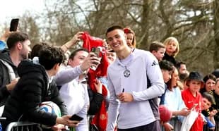 Player taking selfie with fans at event