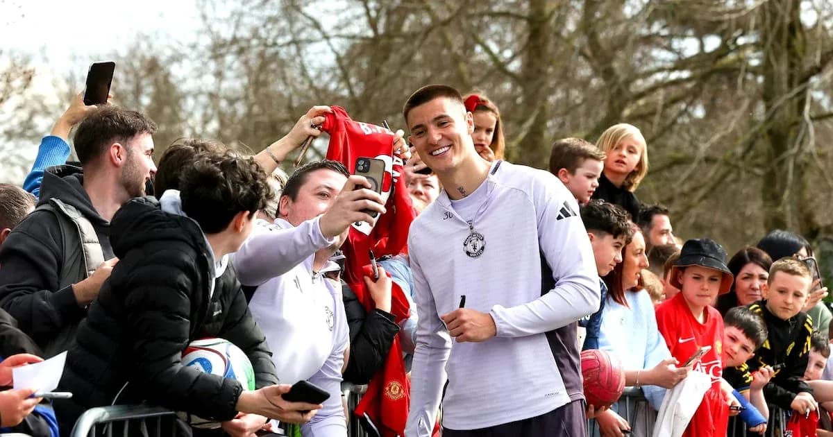 Player taking selfie with fans at event