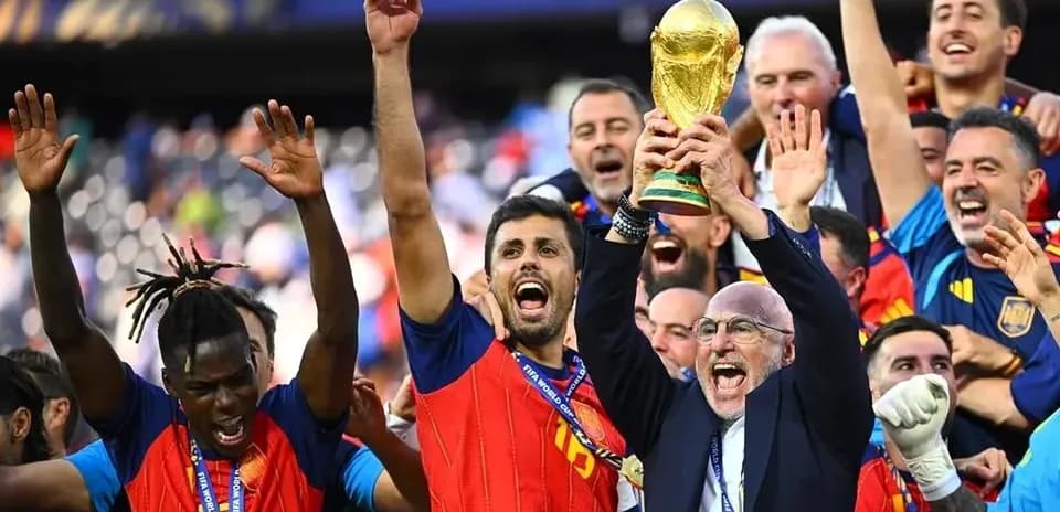 Team celebrating with FIFA World Cup trophy