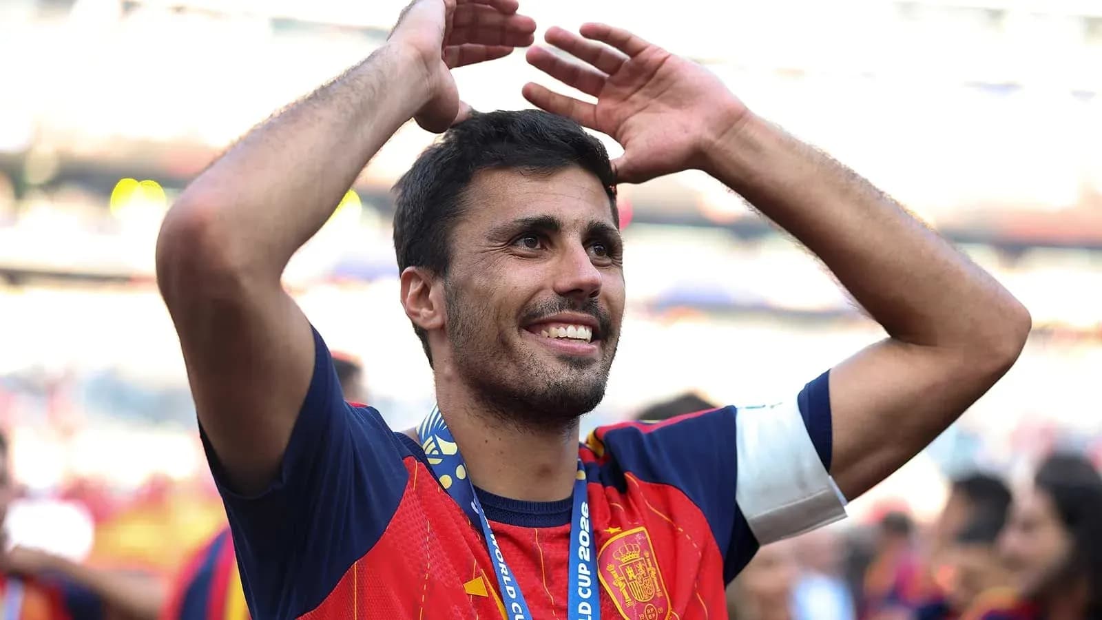 Player celebrating with arms raised after victory
