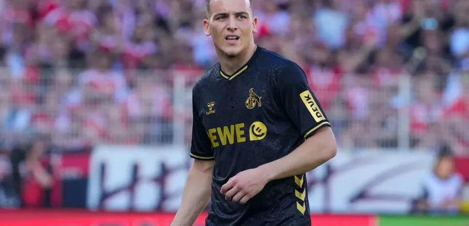 Player in black jersey during match at stadium