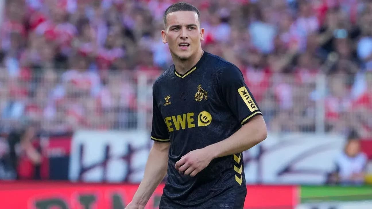 Player in black jersey during match at stadium