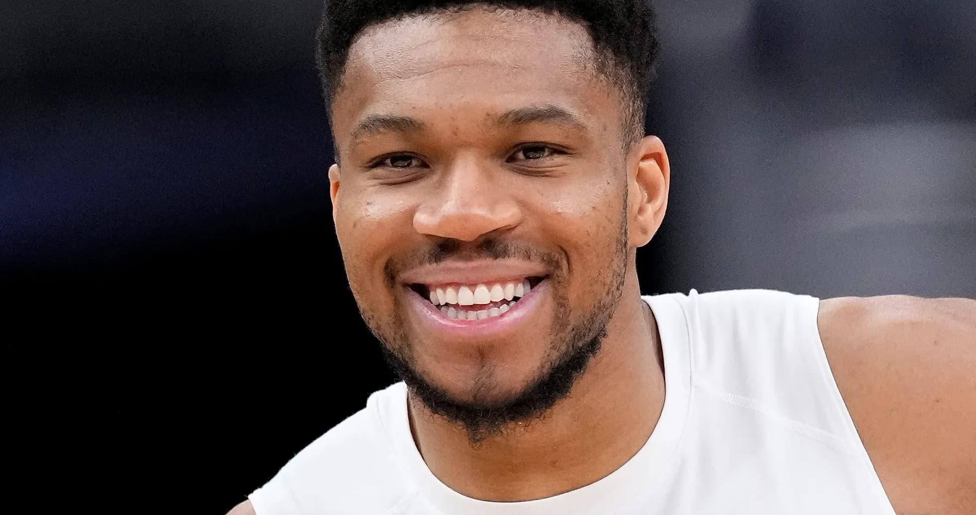 Basketball player smiling during warm-up session