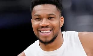 Basketball player smiling during warm-up session