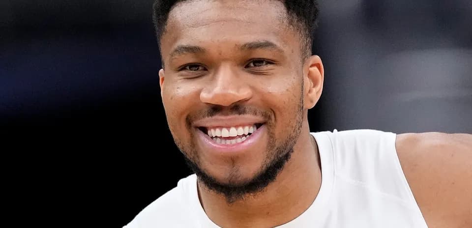 Basketball player smiling during warm-up session