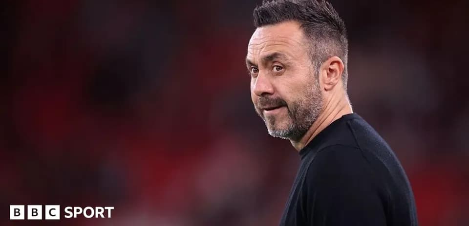 Manager looking towards the pitch during match