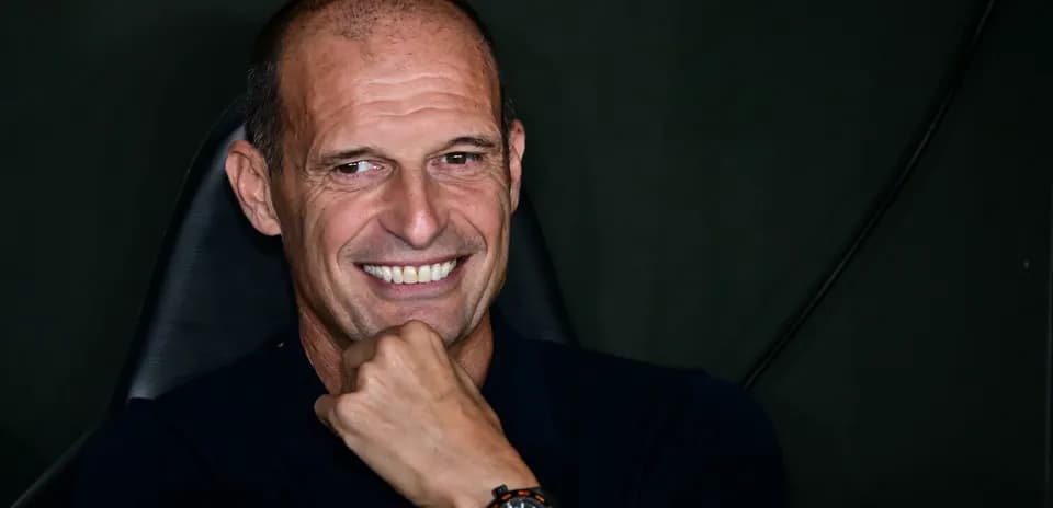 Coach smiling while sitting in chair
