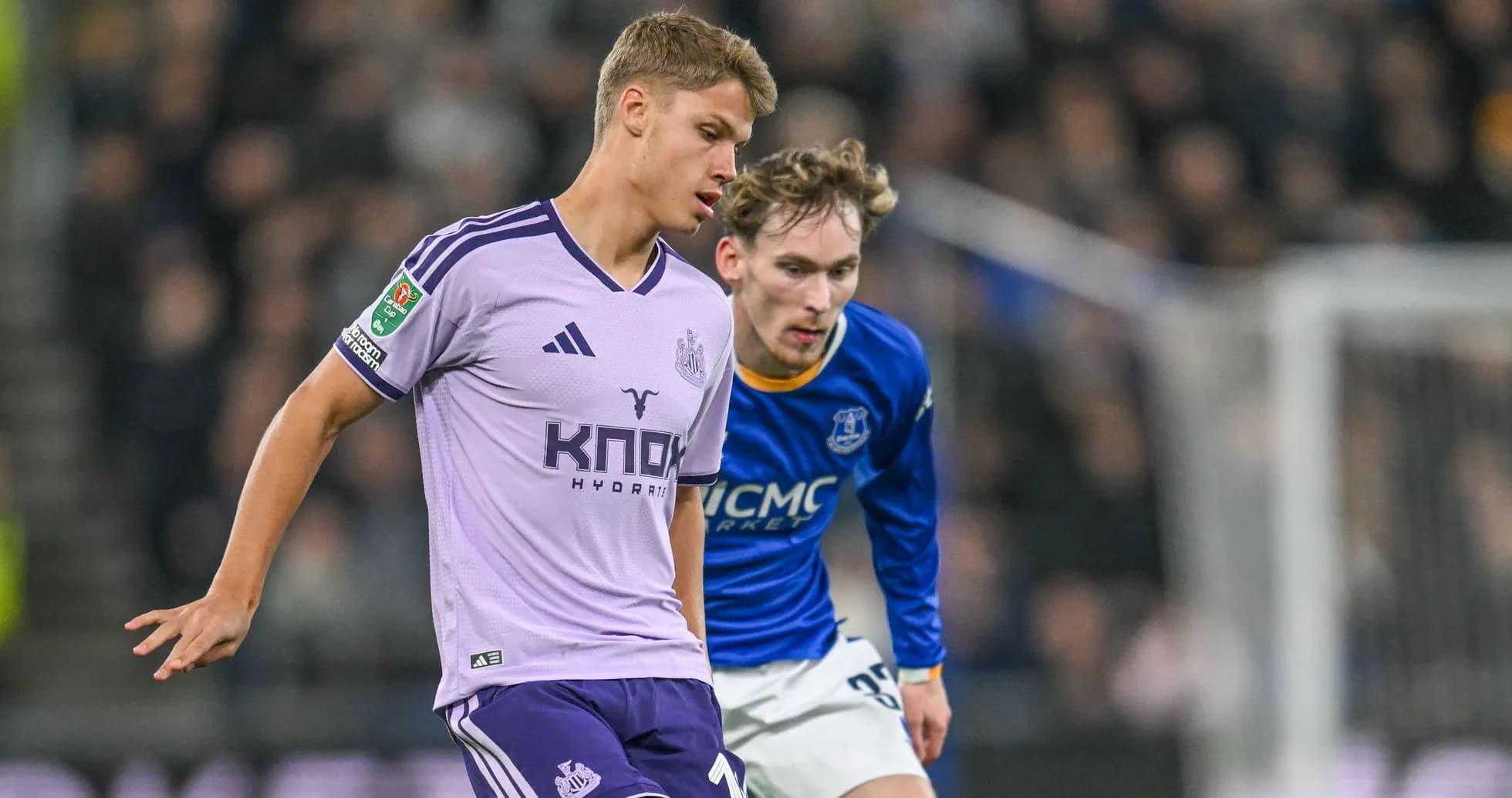 Two players competing for the ball during match