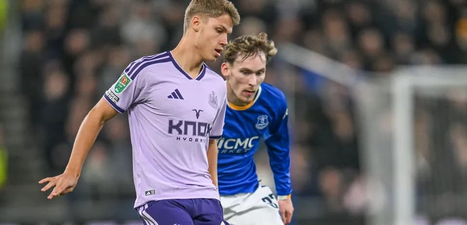 Two players competing for the ball during match