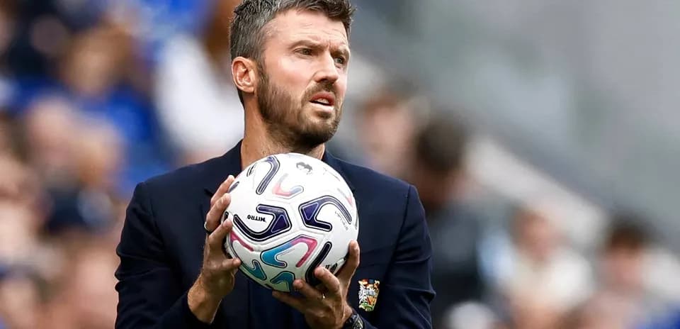 Coach holding ball during a match