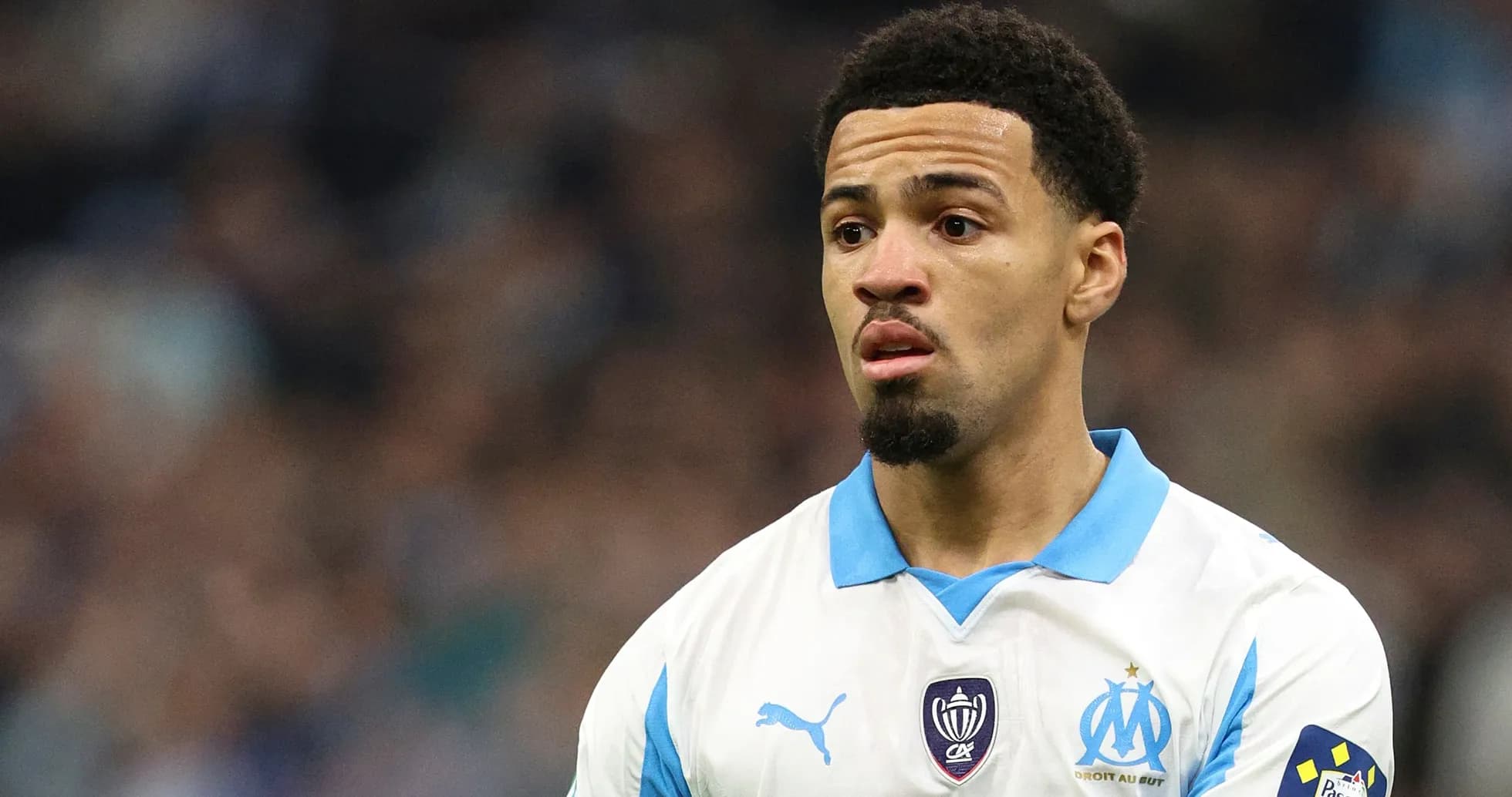 Player wearing Marseille kit on the pitch