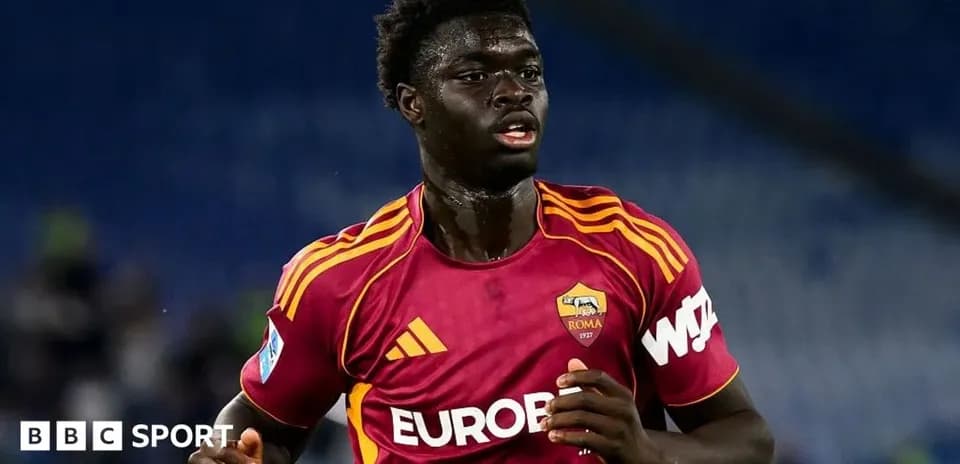 Player running in AS Roma home kit during match
