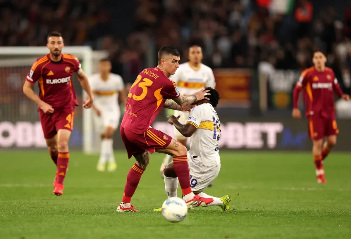 Player tackling opponent during Lecce vs AS Roma match