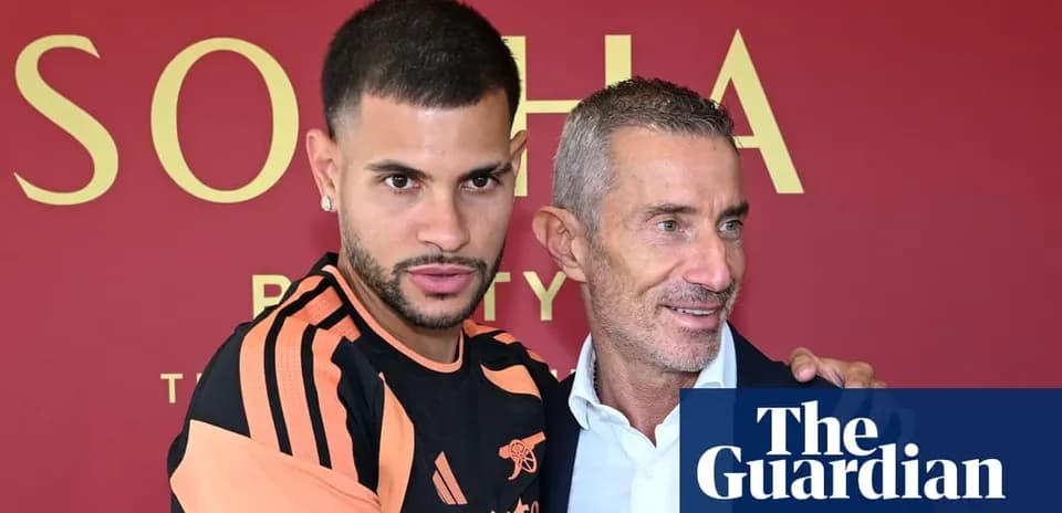Player posing with manager at press event